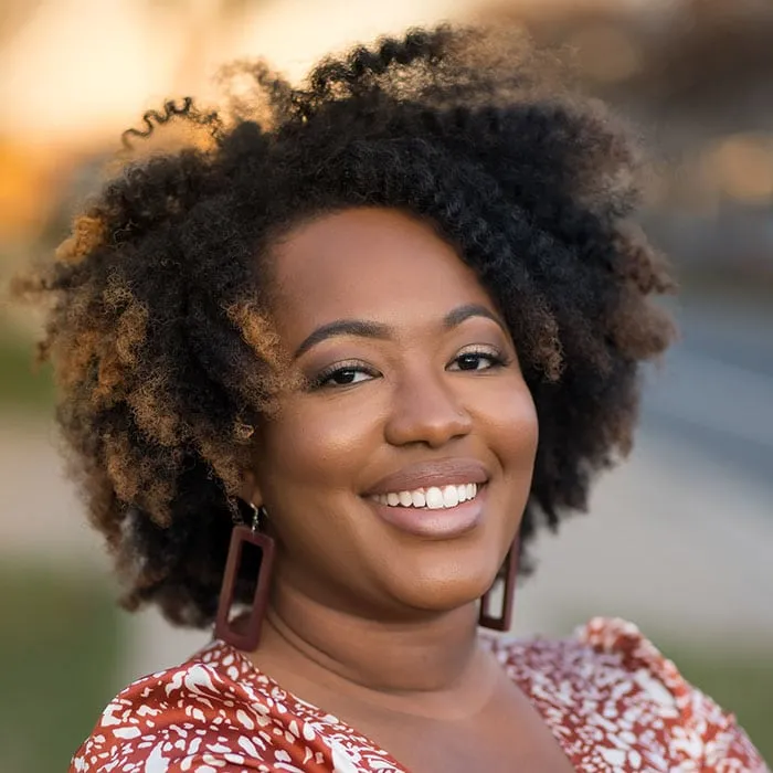 happy curly hair girl impacted-tooth