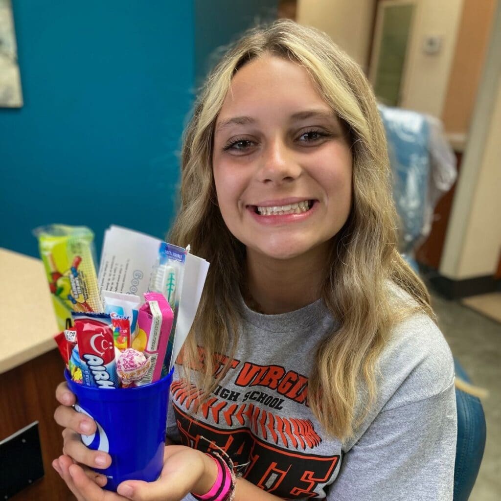 Happy adult patient with gift